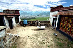 The courtyard of the main temple compound. The temple is on the right, and the kitchen on the left.